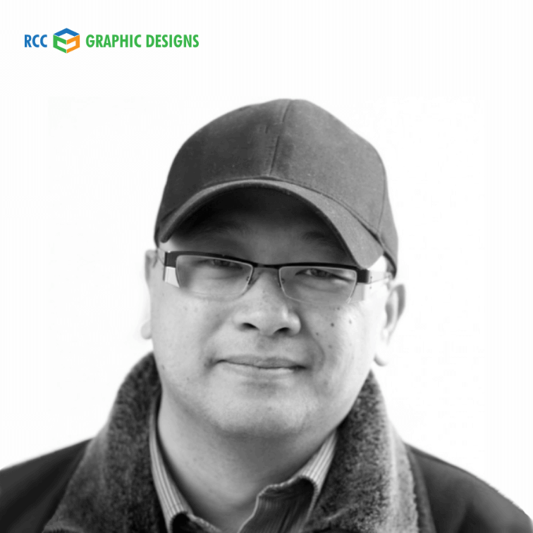 Black and white portrait of RCC Graphic Designs team member wearing cap and glasses
